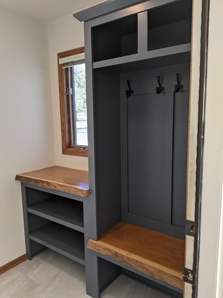 A mudroom locker unit with a live-edge timber bench