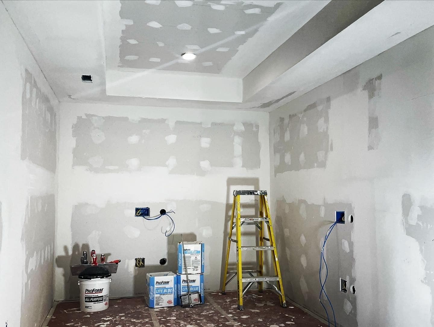 A room taped and finished, waiting on texture and paint