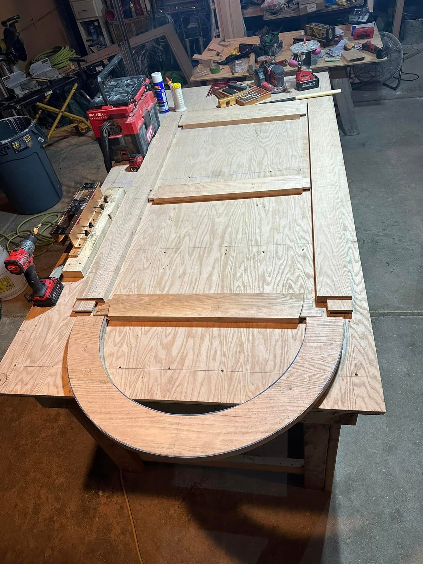The template for an arched door laid out on the bench